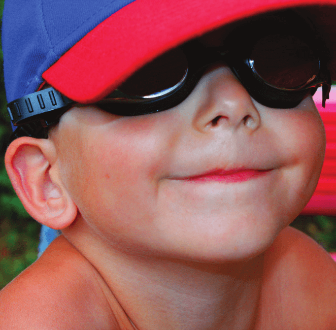 An image of a young boy with aniridia smiling